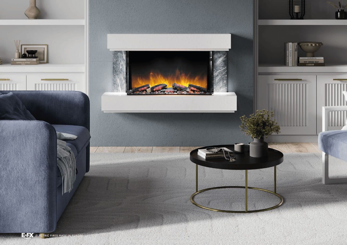 Modern living room featuring a white wall-mounted fireplace, blue sofa, and round black coffee table.